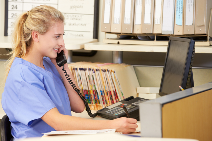 Medical coordinator scheduling rides by phone