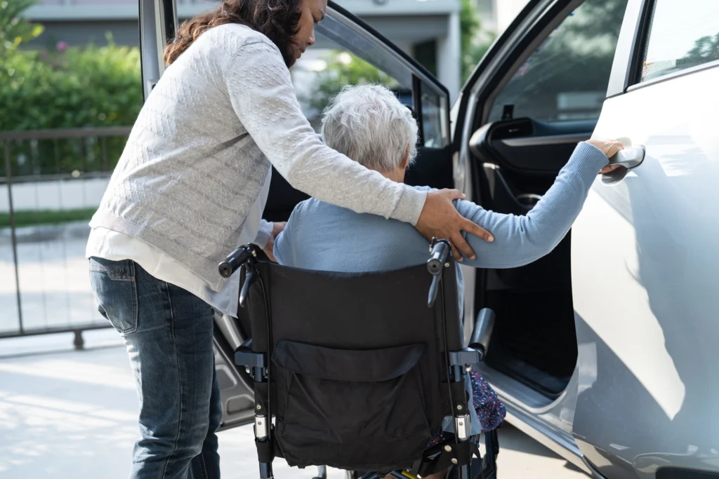 Assisting wheelchair passenger into vehicle